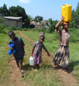 Catherine, her brother Michael, and their mother fetching water.