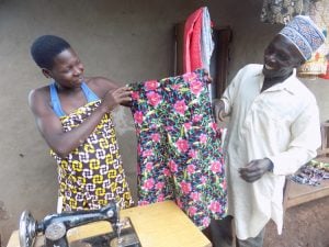 Tailor Made: a student proudly showcases a garment she made. 