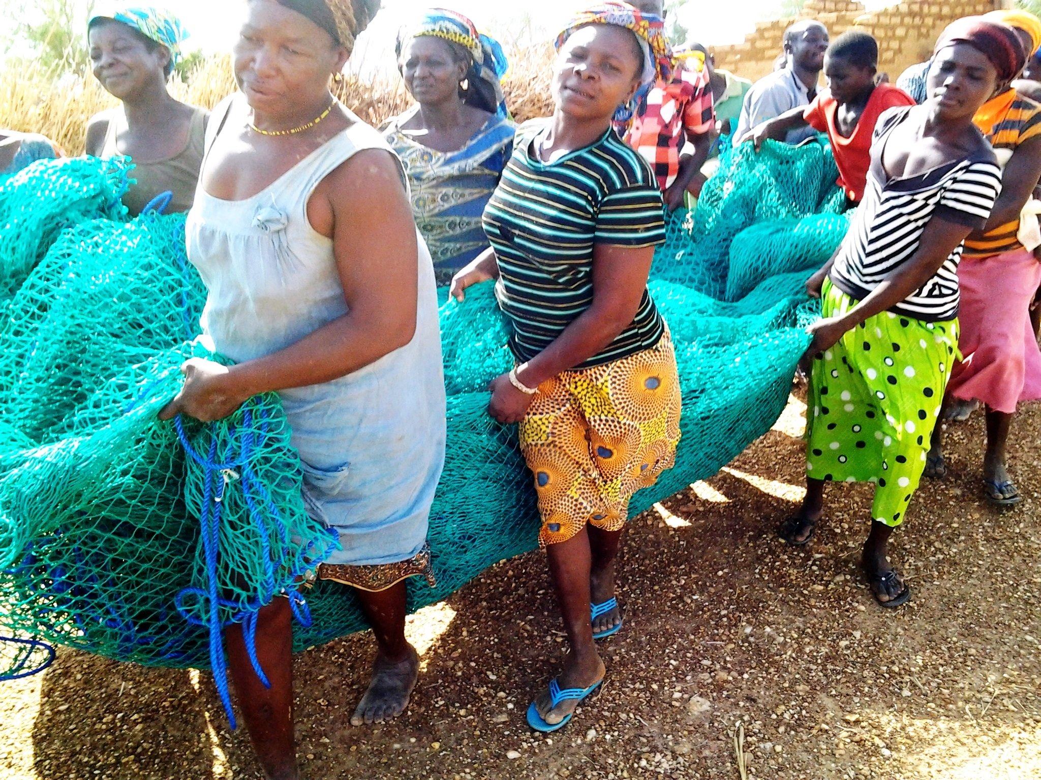 women fish change: hauling in a large catch in northern Ghana International Women's Day 2018 #IWD2018 #MyFeminism