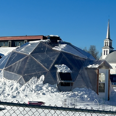 The new greenhouse has been installed. Dome covered in snow